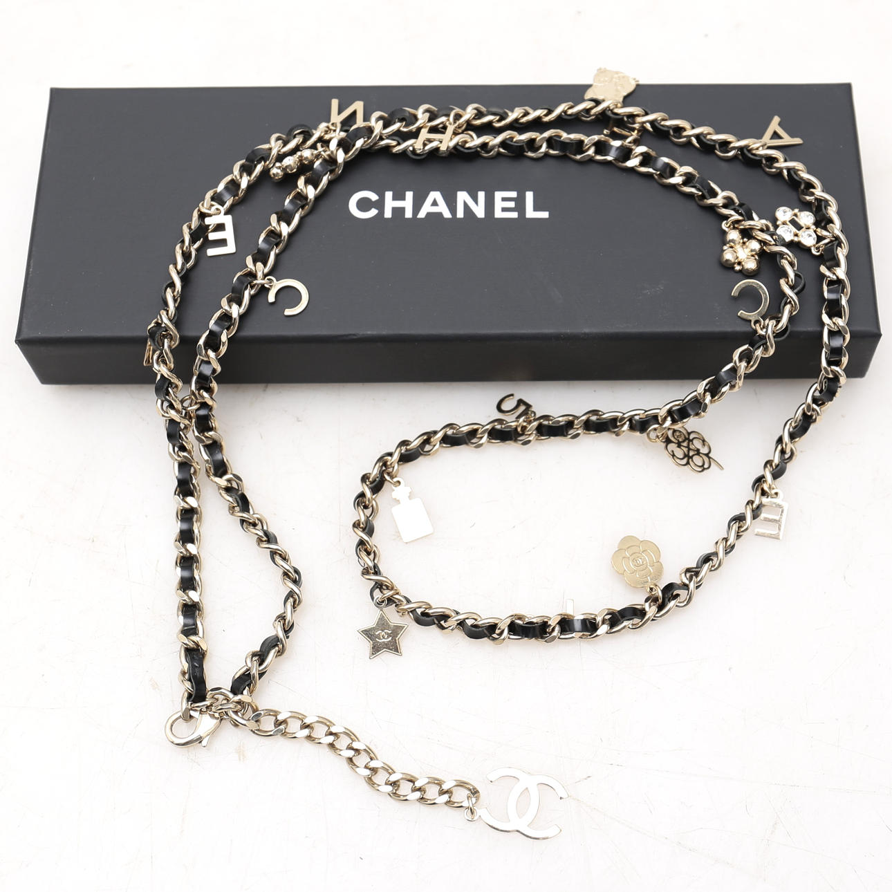 CHANEL. Chain belt with charms.