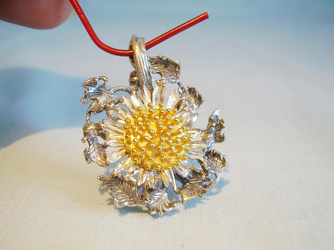 HÄNGE BROSCH SILVER TISTEL 830.