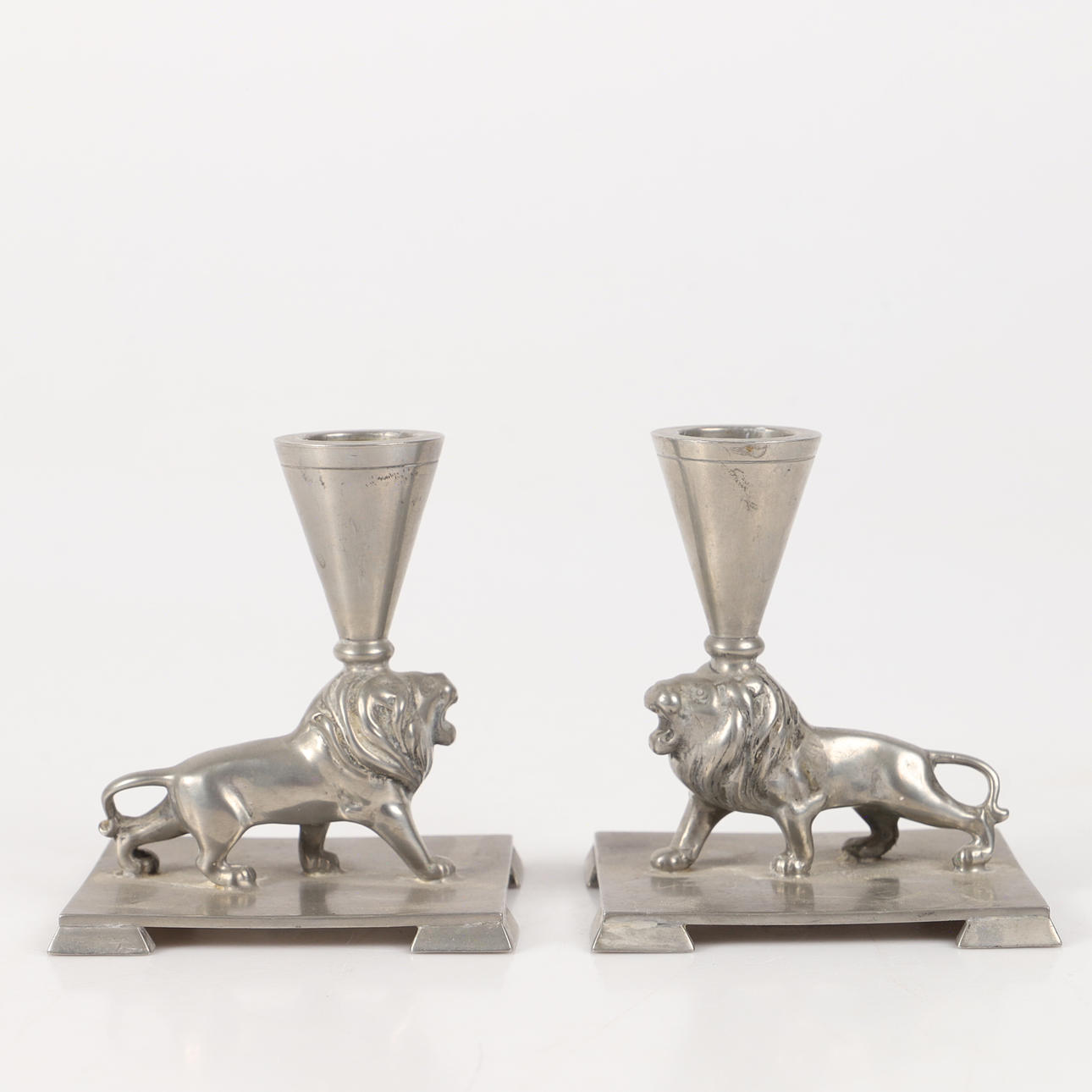 ERNS SVEDBOM. Candlesticks, 1 pair borne by lions, teak.