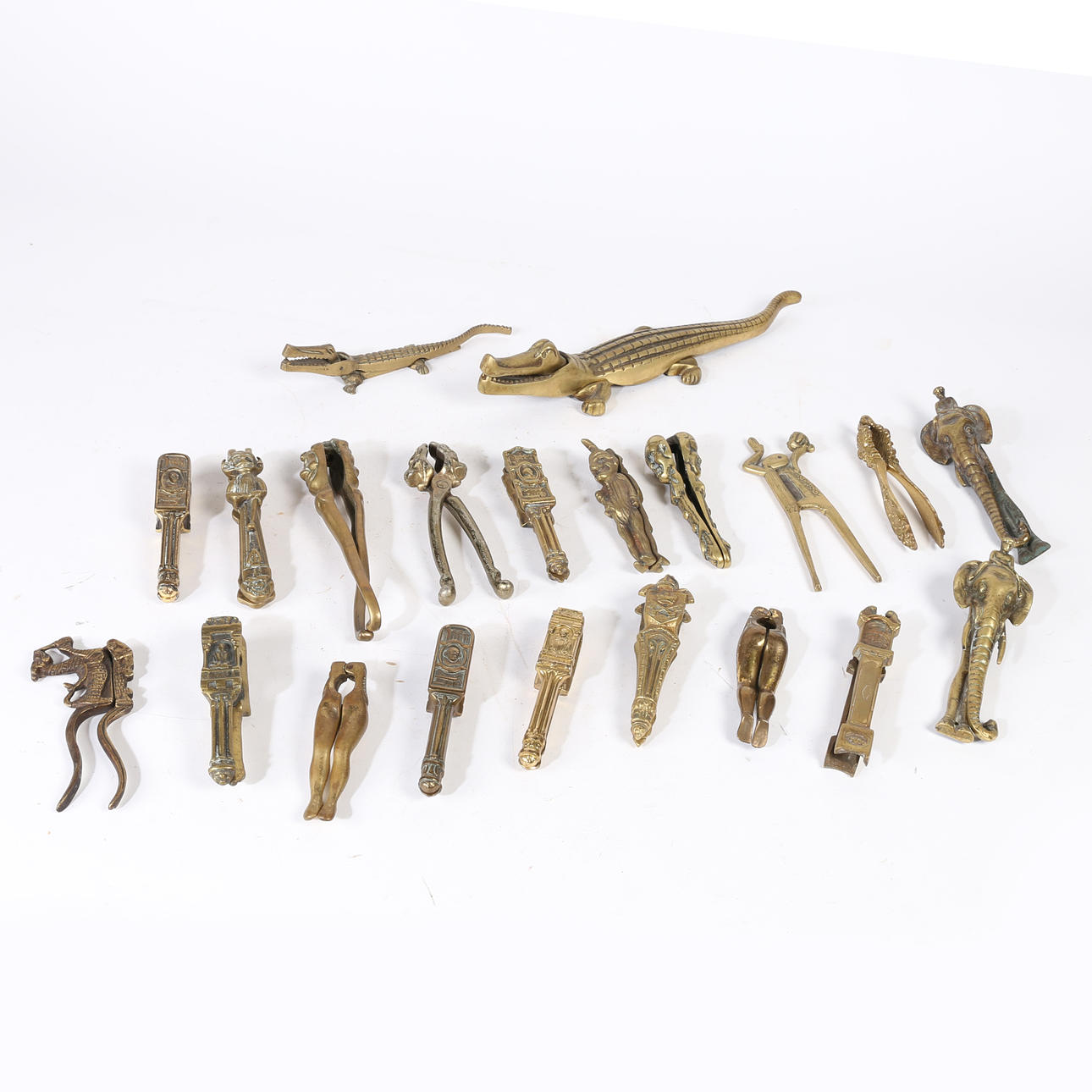 A COLLECTION OF 20TH CENTURY BRASS NOVELTY NUTCRACKERS (QTY). Silver ...