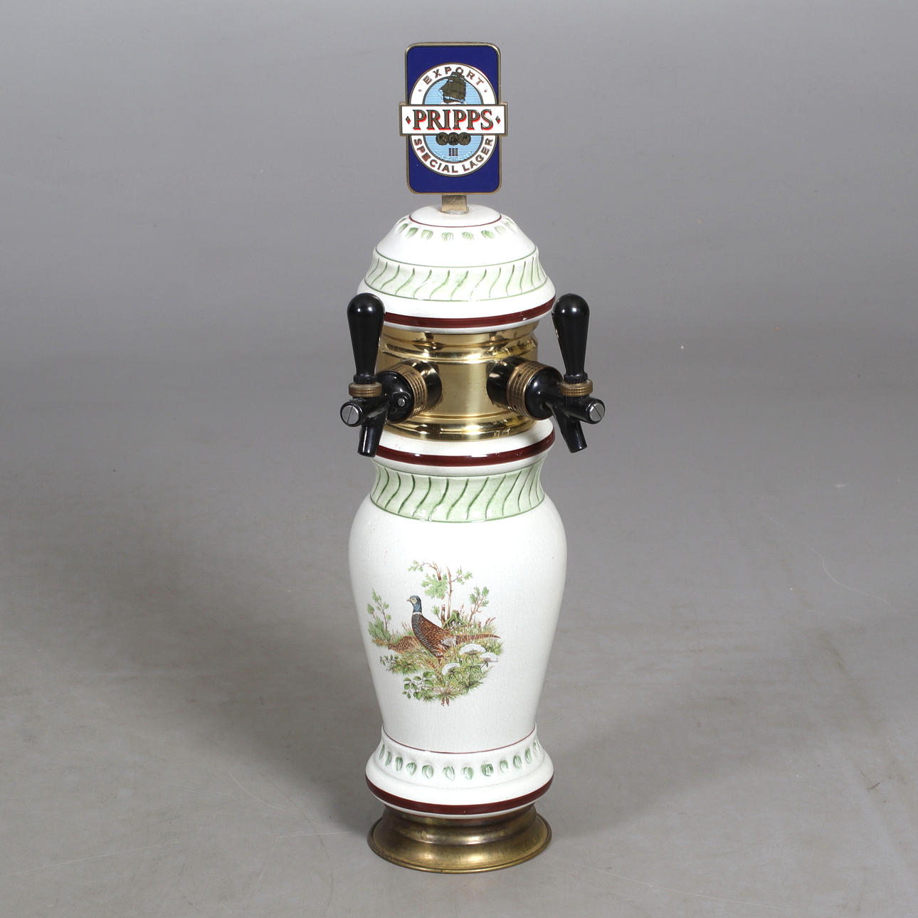 ÖLTAPP. porslin, metall "Pripps", 1900-tal.