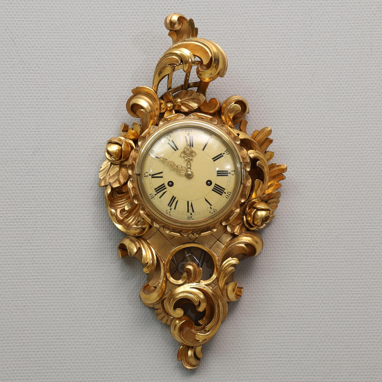 A 20th century gold pendant wall clock.