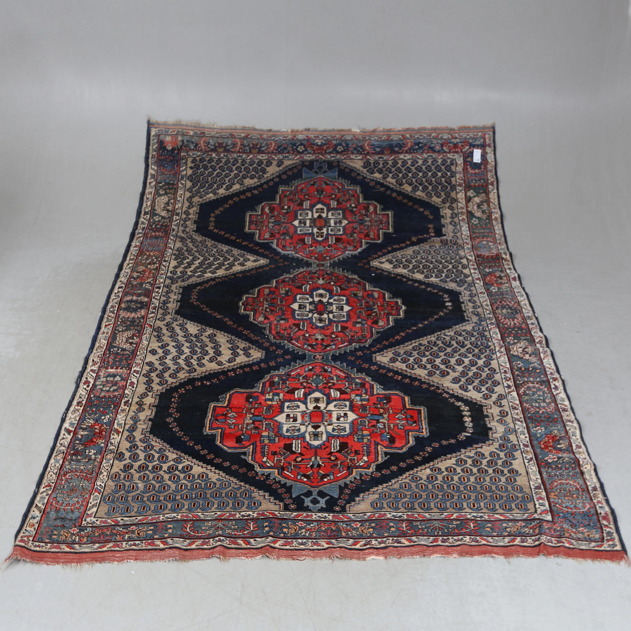 An oriental rug, approx. 300x214 cm.