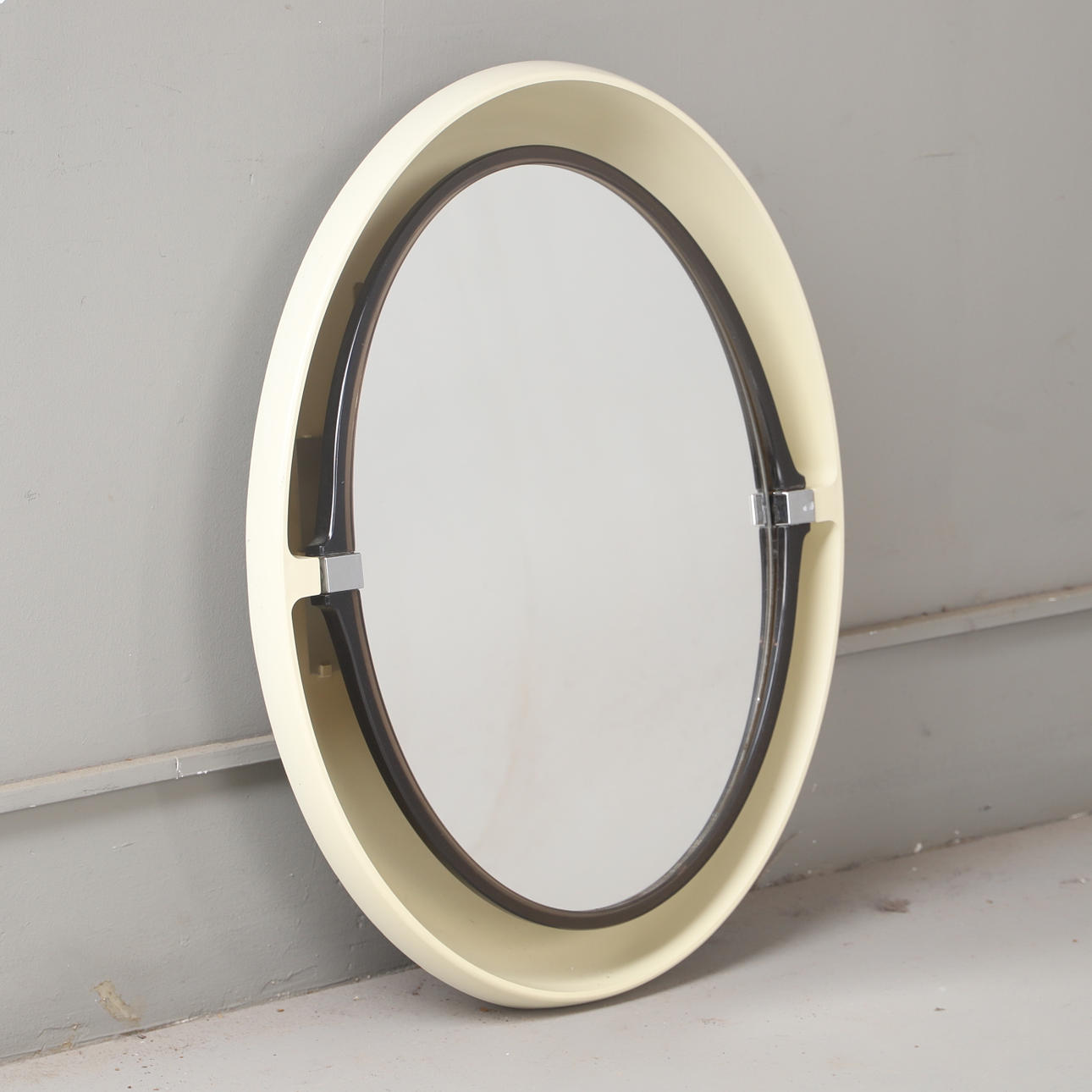 A 'Space Age' mirror, Allibert, plastic with lighting, 1970s.