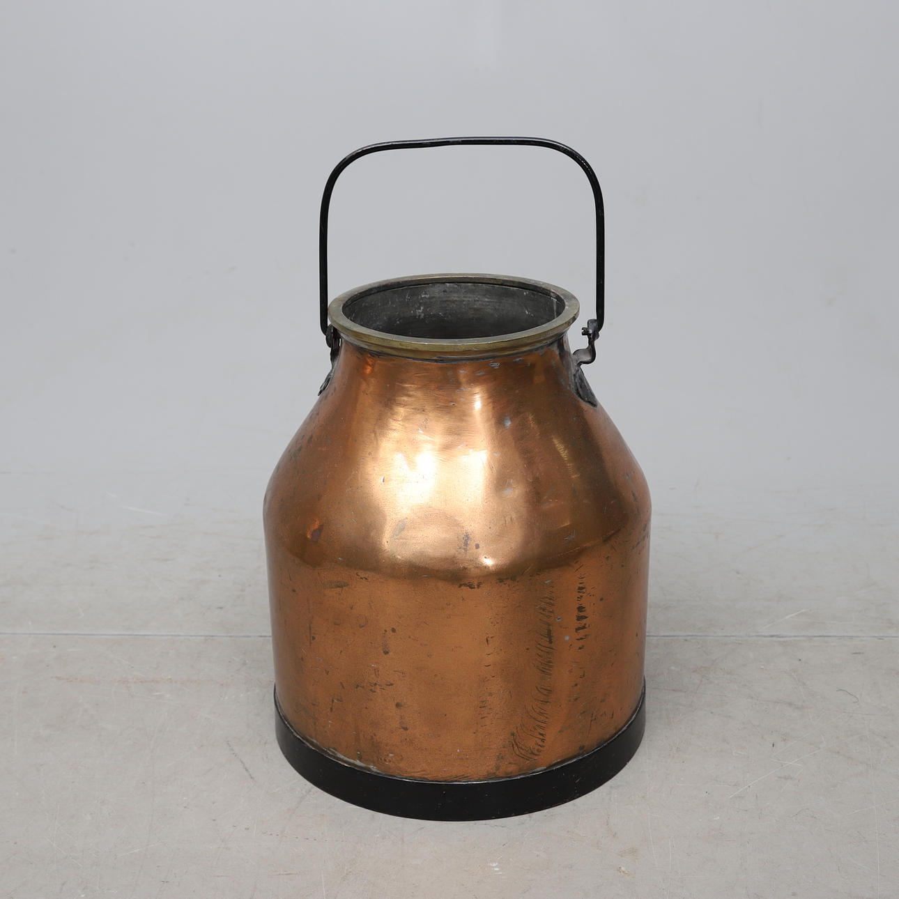 A 20th-century copper milk pan.