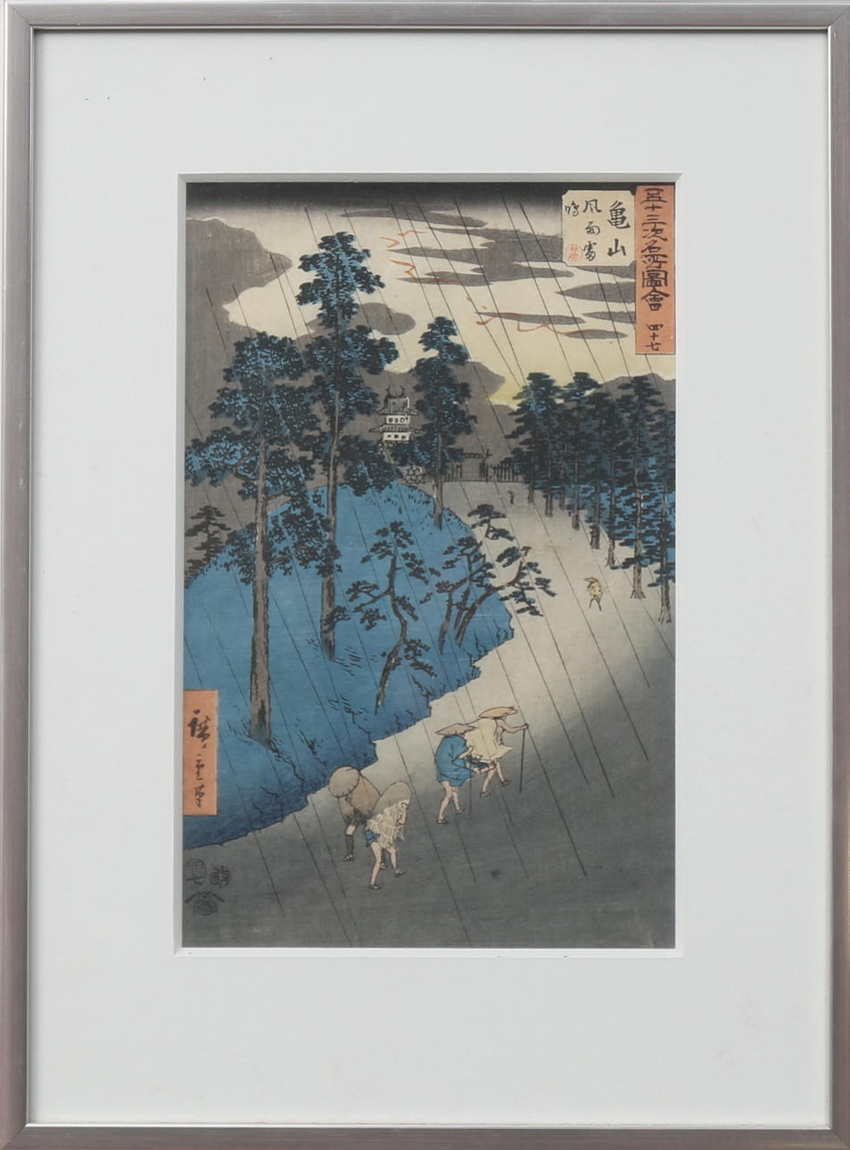 ANDO HIROSHIGE. Vandrare i regnigt landskap. Träsnitt på rispapper troligen 1800-talets mitt.