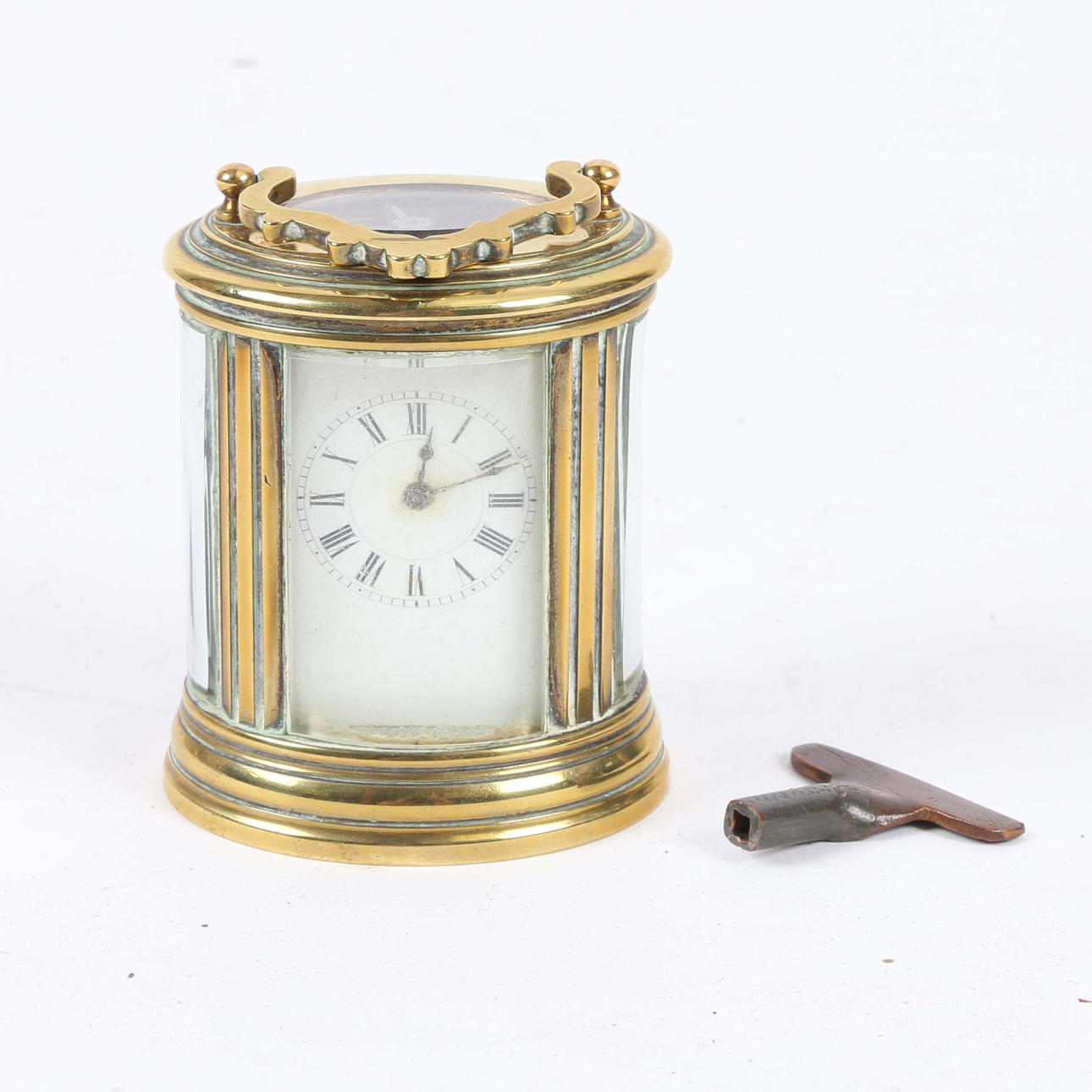 A LATE 19TH CENTURY BRASS MINIATURE CLOCK.
