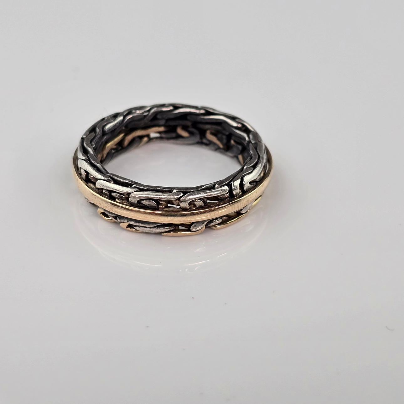 gold/silver ring, silver braid.