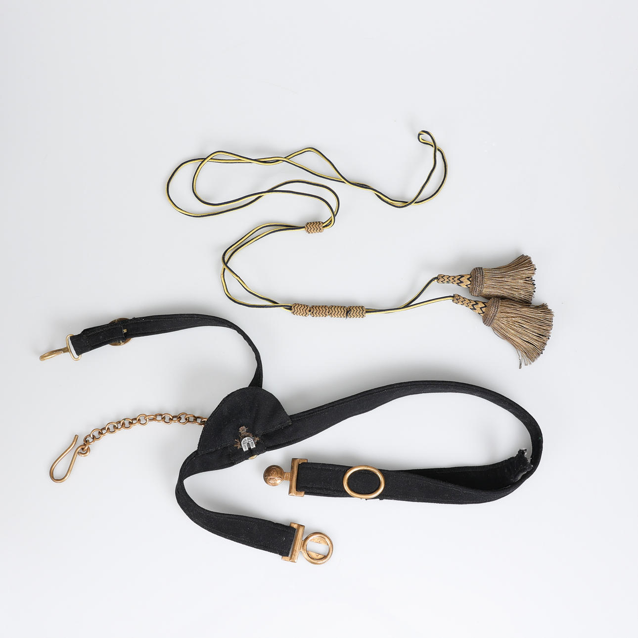 SABRE PENDANT and two tassels.