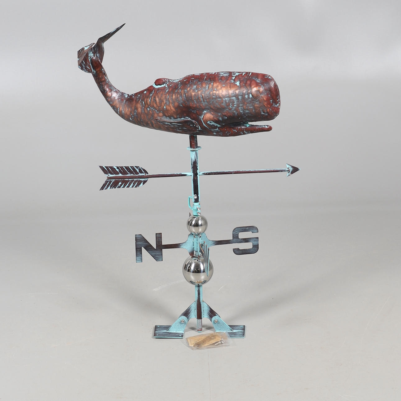 A DECORATIVE COPPER WEATHER VANE.