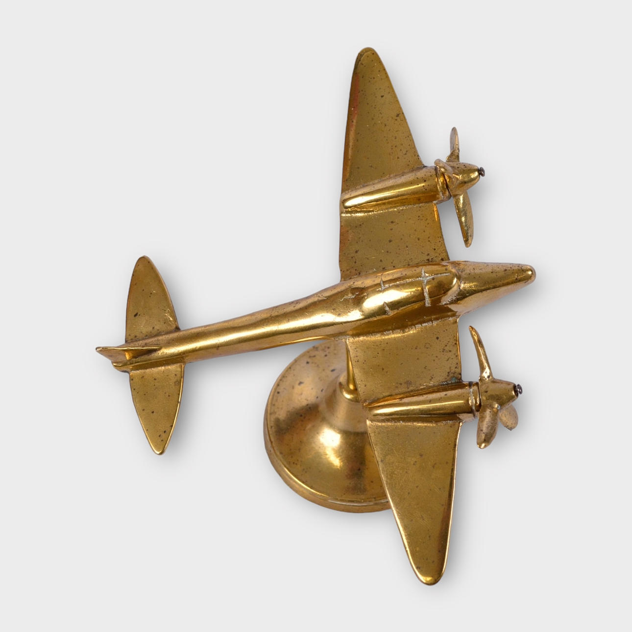 A 20th century brass aeroplane figurine.