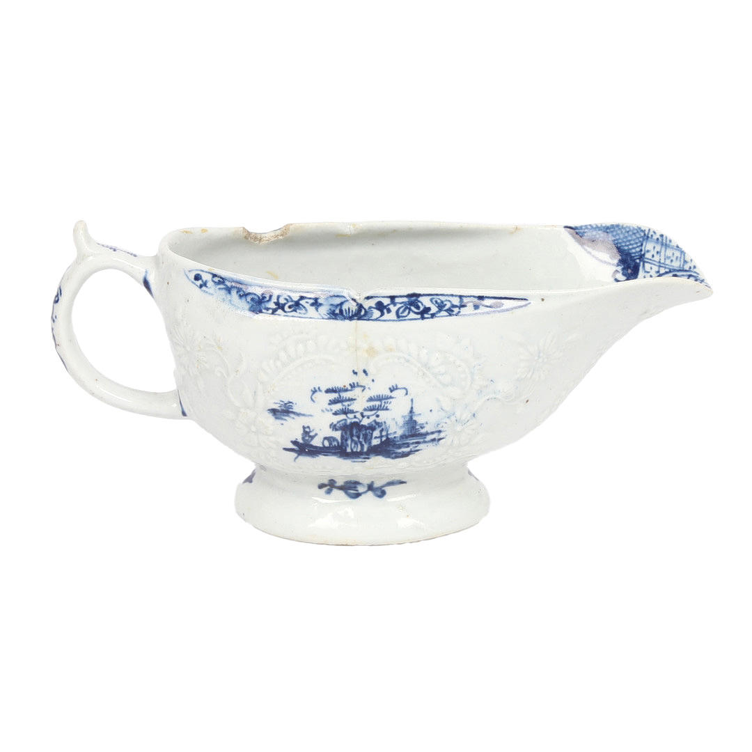 A LOWESTOFT PORCELAIN SAUCEBOAT CIRCA 1764.