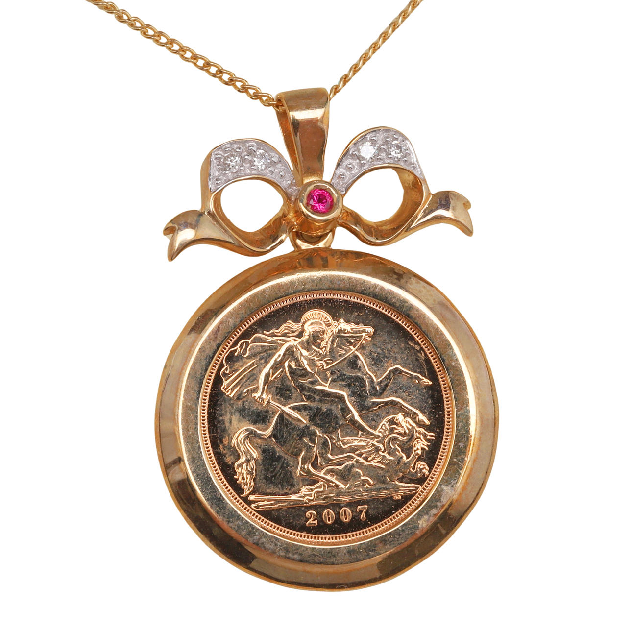 A GOLD HALF SOVEREIGN IN GOLD, RUBY AND DIAMOND PENDANT MOUNT ...