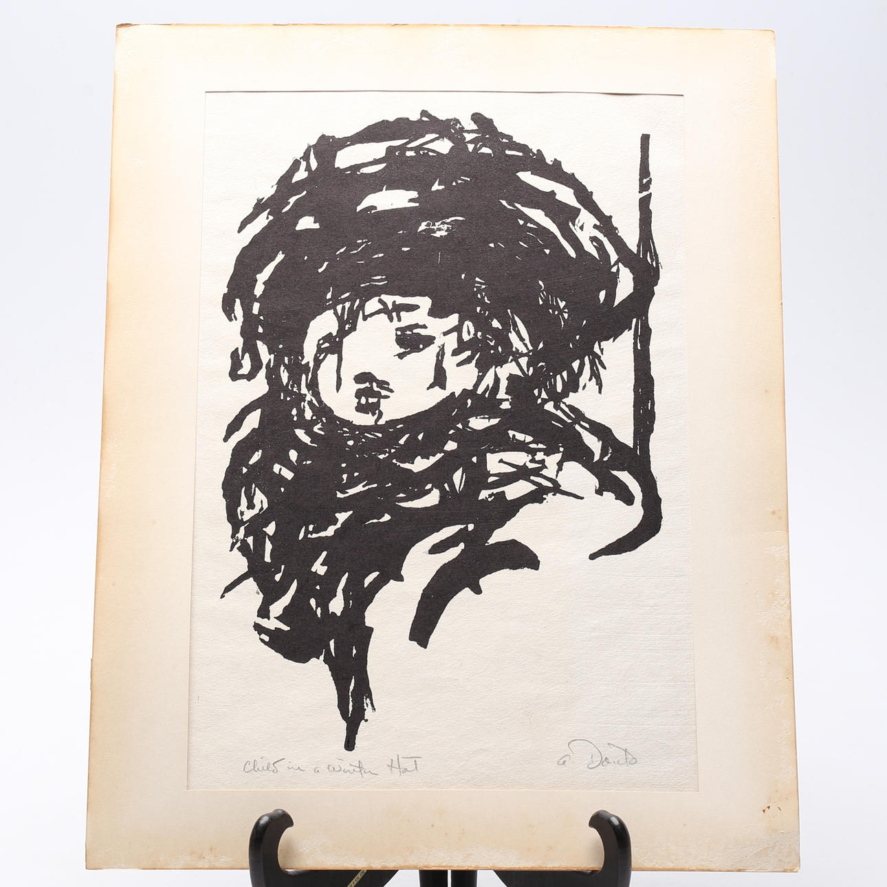 ARTHUR C. DANTO. woodcut, “Child with winter hat”.