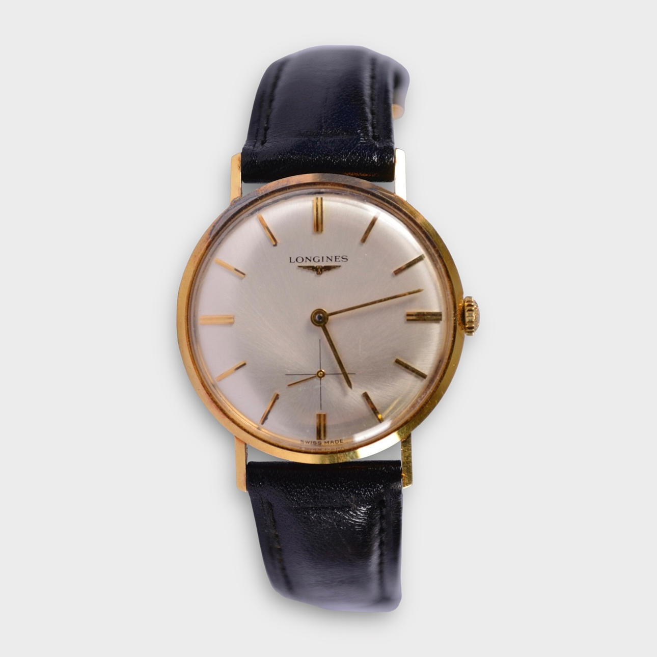 A Longines wristwatch, 18 karat gold.