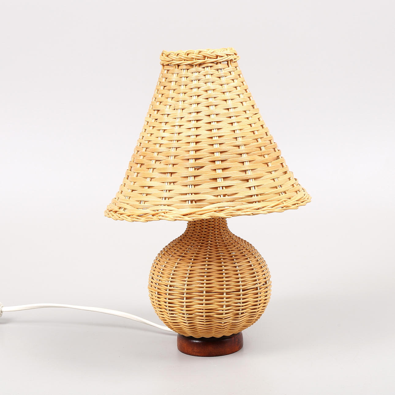 A rattan table lamp, 1950s/60s.