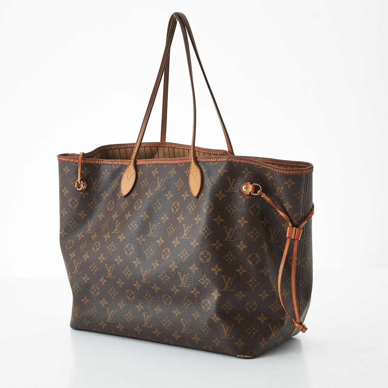LOUIS VUITTON, “Neverfull MM”, shoulder bag, monogram pattern, cognac leather details, inside with two compartments, one with zipper, marked with date code (France 2015).