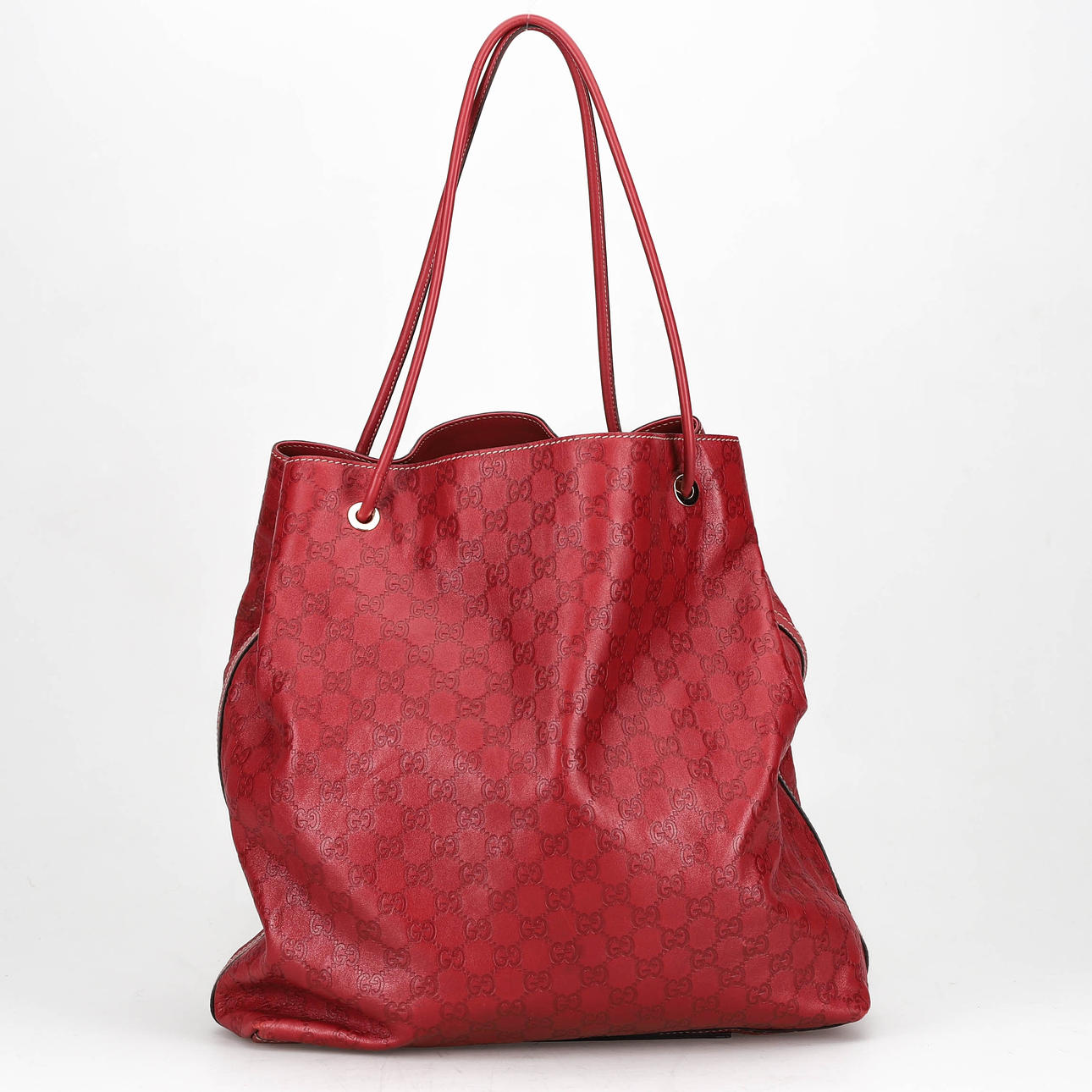 GUCCI, Tasche, Tragetasche, rotes Leder mit Monogramm-Prägung.