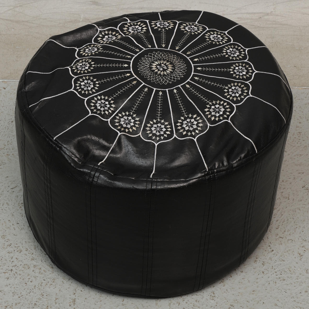 A MIO leather seat pouf, contemporary.