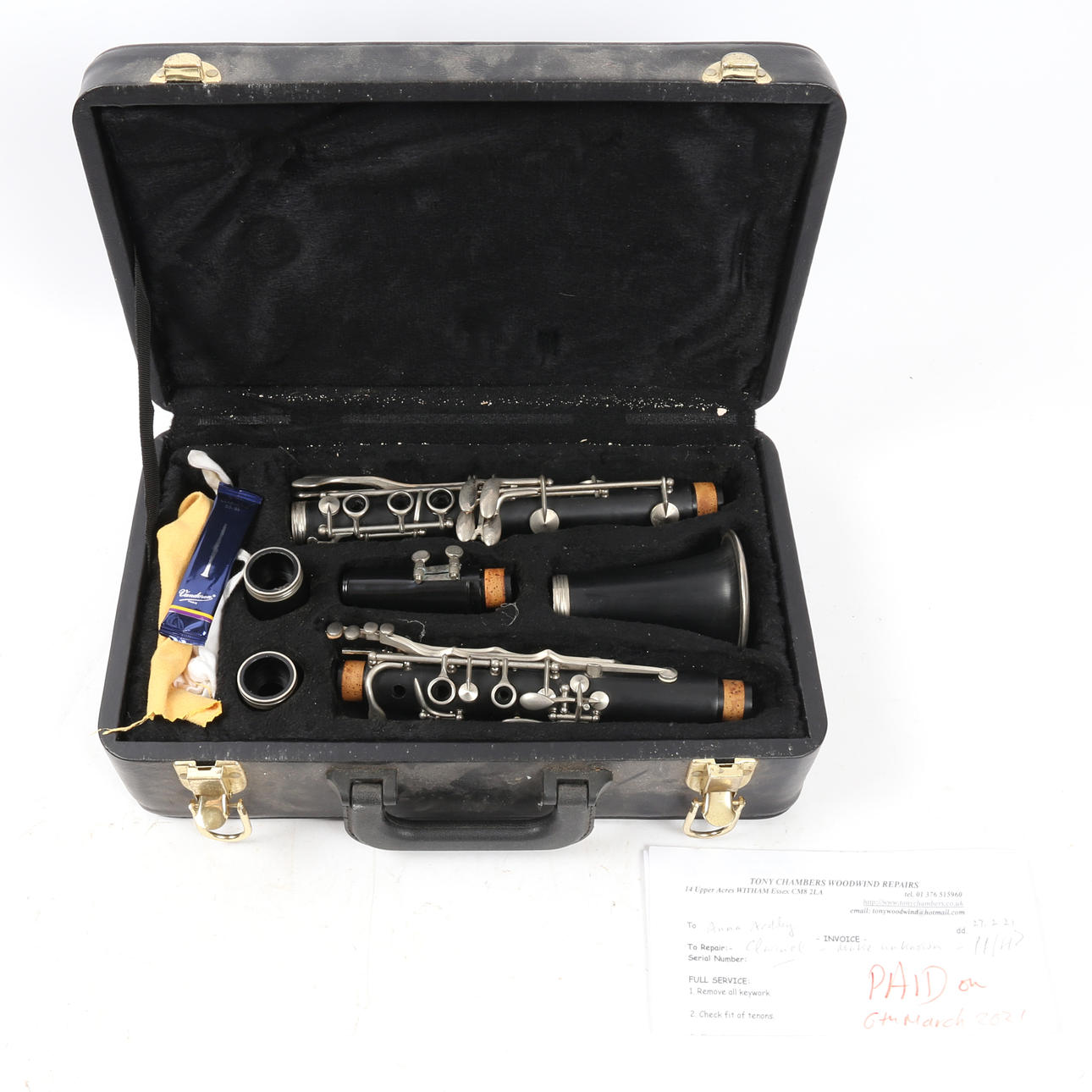 A CASED CLARINET.