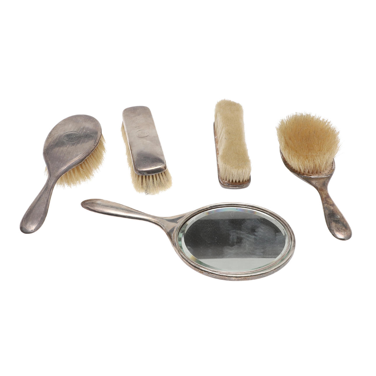 A GEORGE V FIVE-PIECE SILVER DRESSING TABLE SET.
