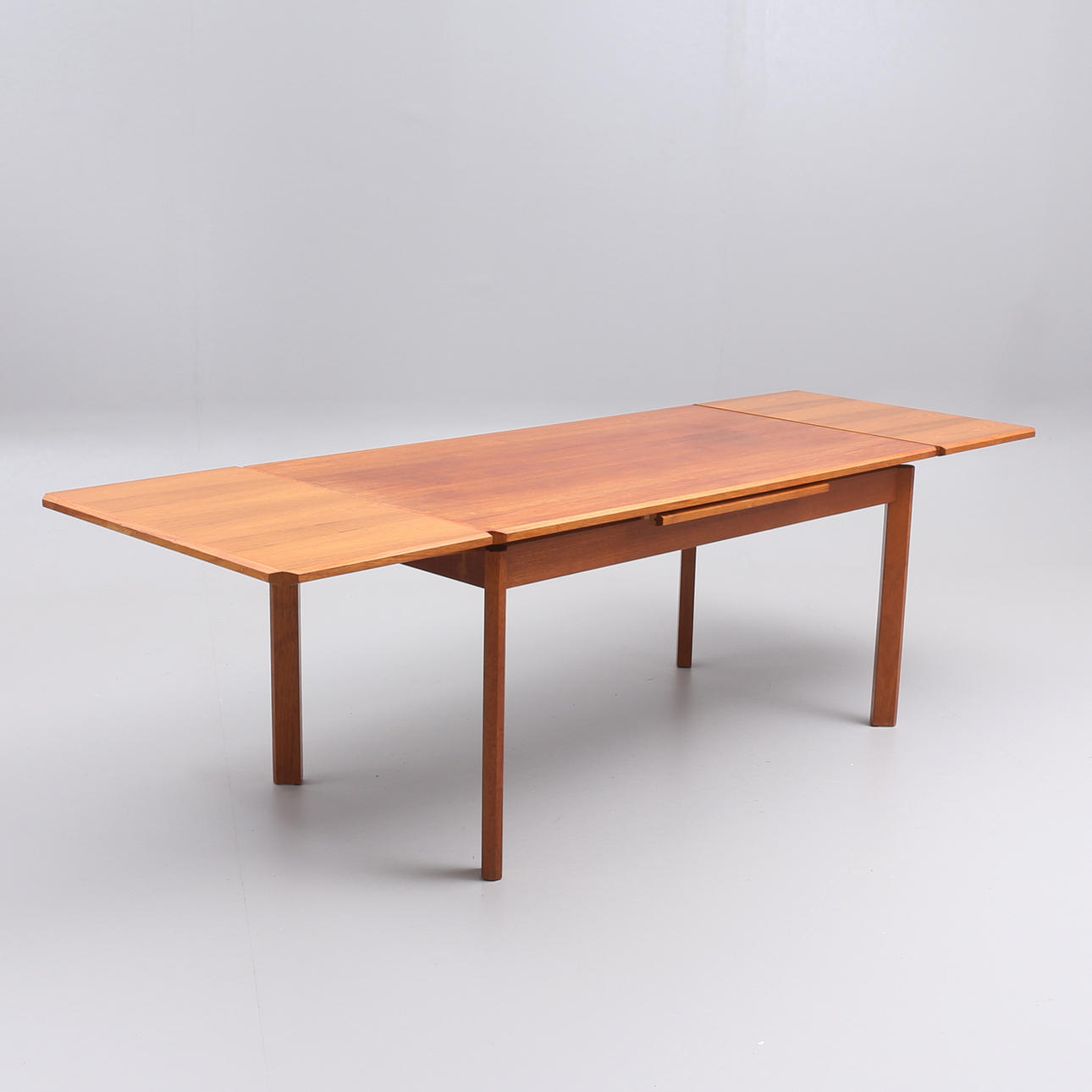 A teak dining table, circa mid 20th century.