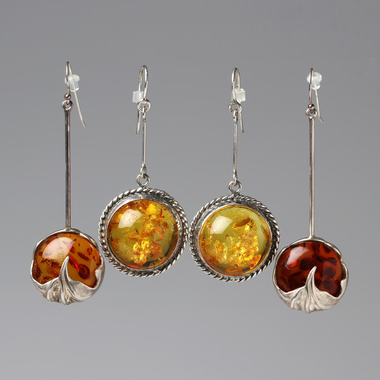 AMBER EARRINGS, A PAIR. Silver with cabochon-cut amber.