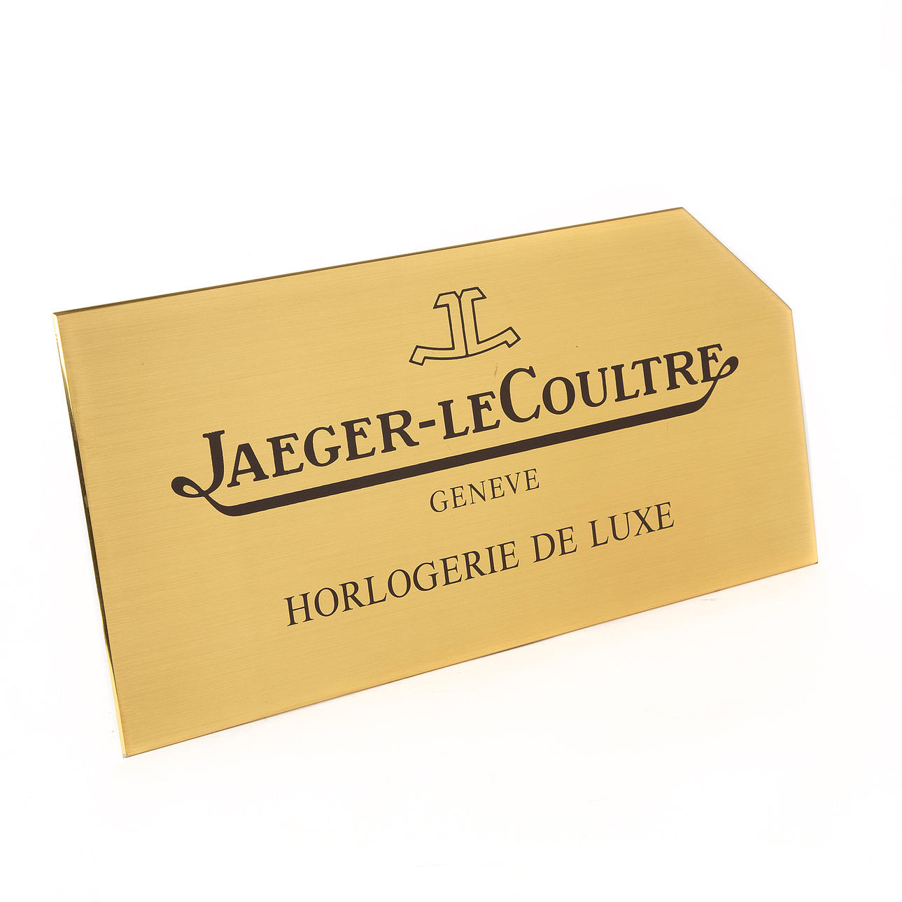 JAEGER-LECOULTRE, a brass plaque.