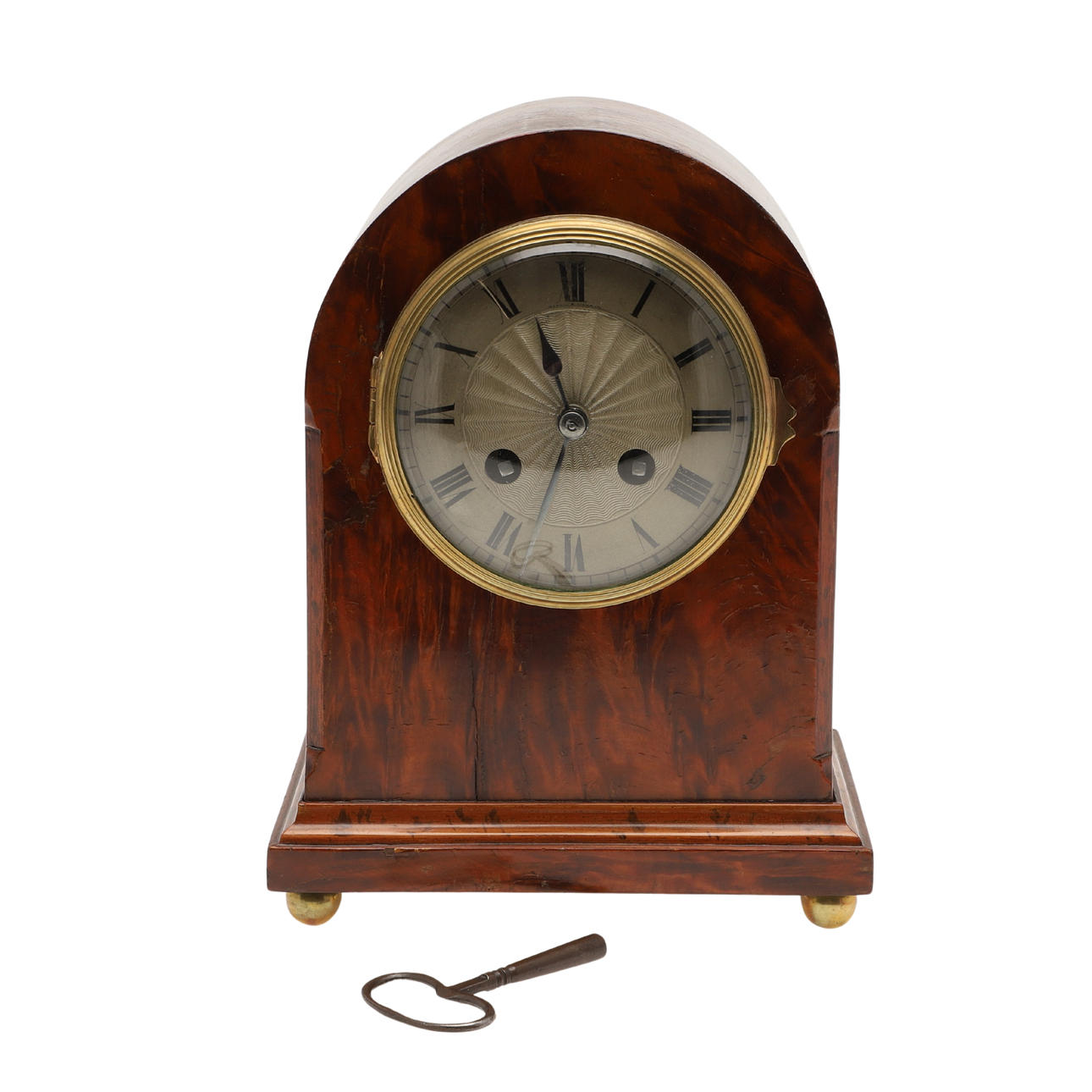 A BURR WOOD DOME TOPPED MANTEL CLOCK.