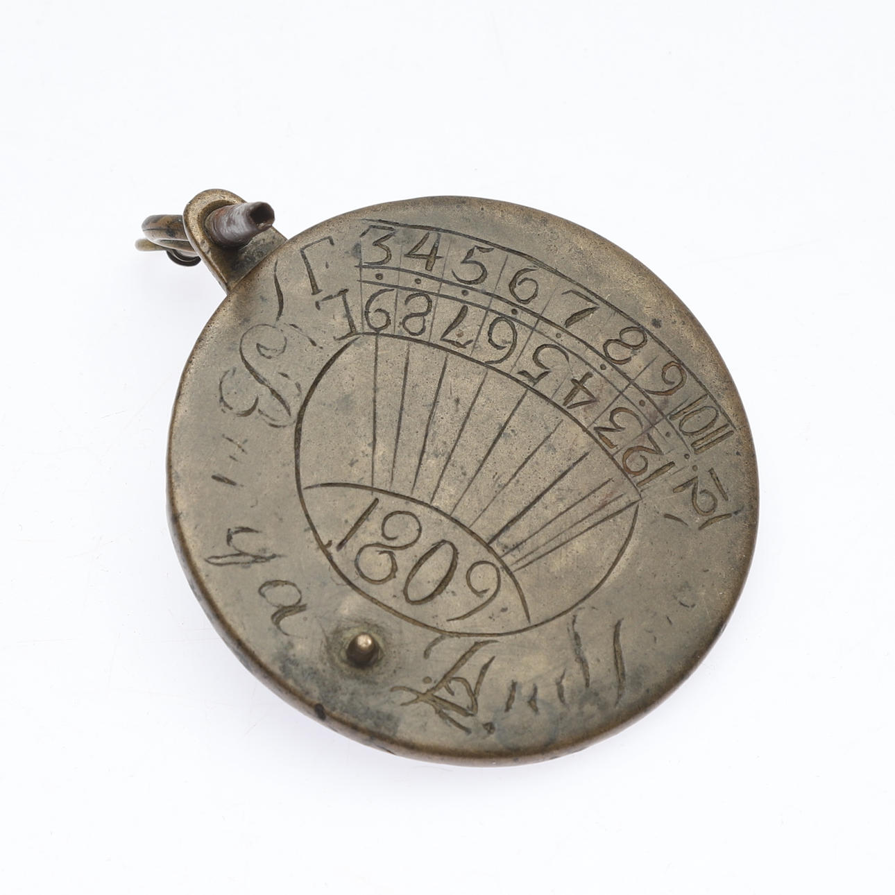 A brass sundial, probably Sweden, dated 1809.