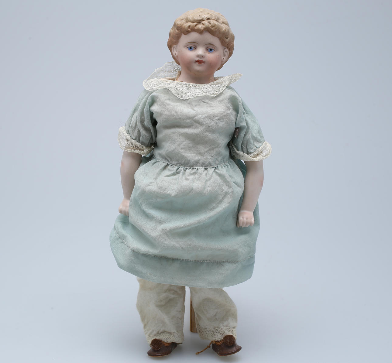 DOCKA, porslinshuvud, 1900-talets början.