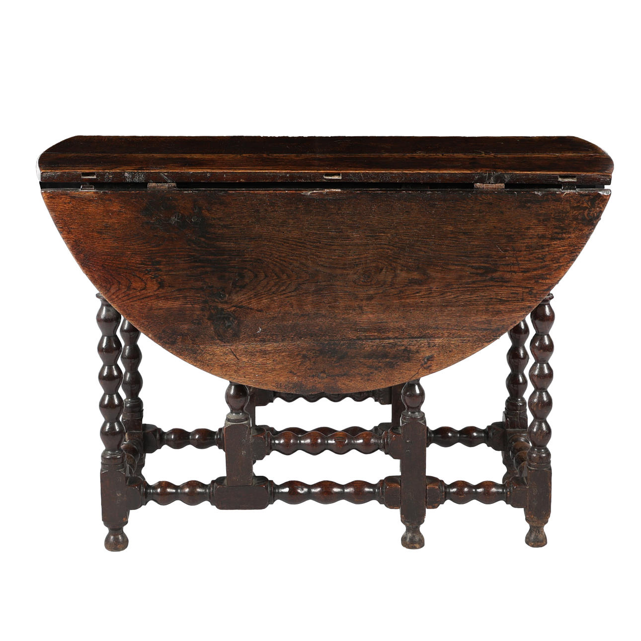 A CHARLES II OAK DROP LEAF DINING TABLE.