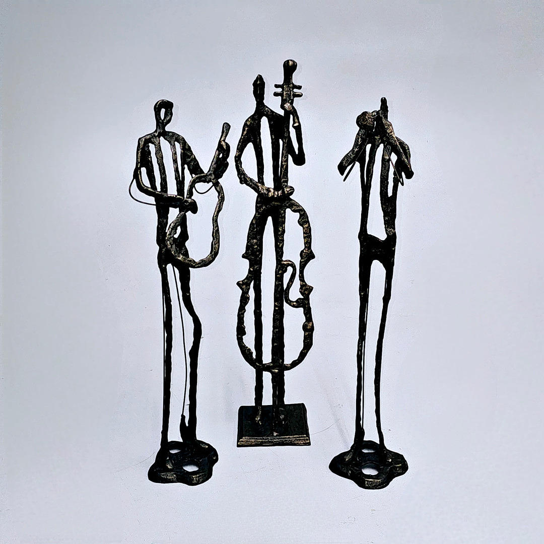 THREE MUSICIANS. CAST IRON SCULPTURES.