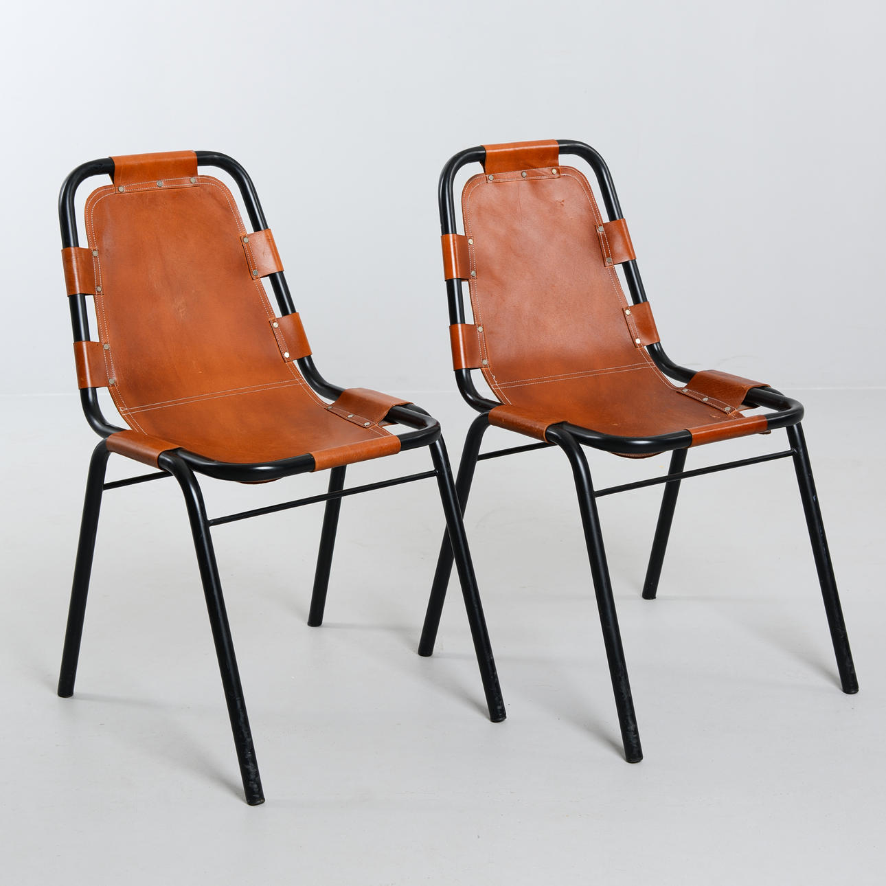 CHARLOTTE PERRIAND. A pair of “Les Arcs” chairs, France, 1960s 