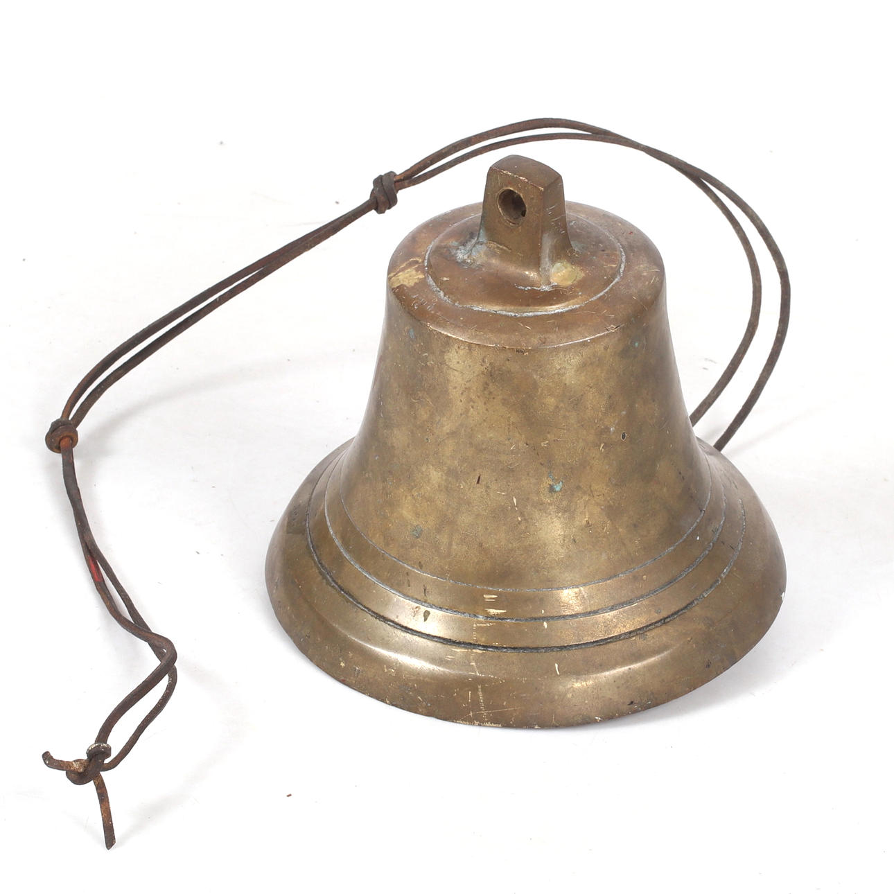 A brass bell, 20th century.