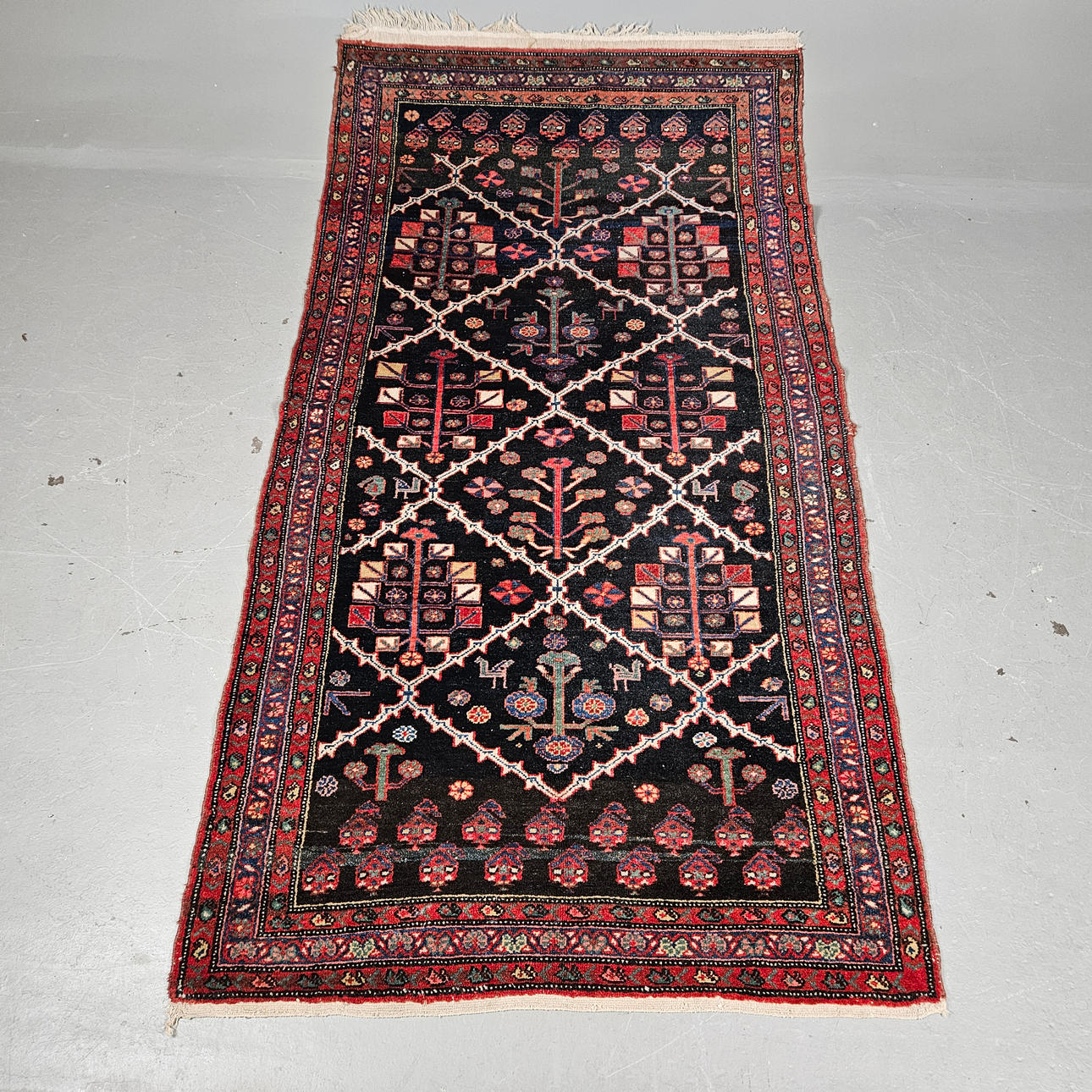 An oriental rug, approx. 202x106 cm.