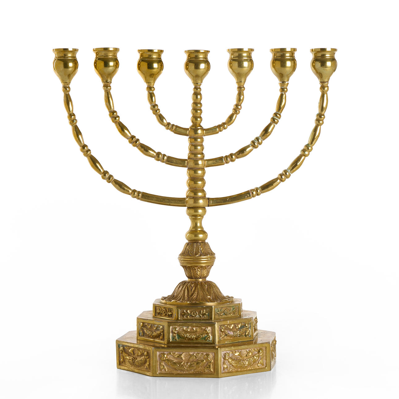 A brass 7-arm menora/candelabra, circa 1900.