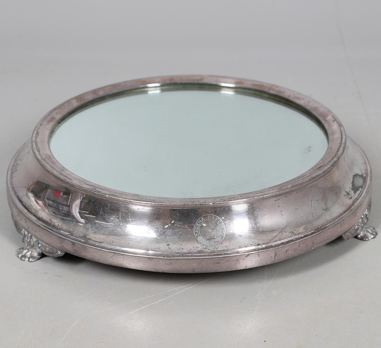 A SILVER PLATED MIRROR PLATEAU.