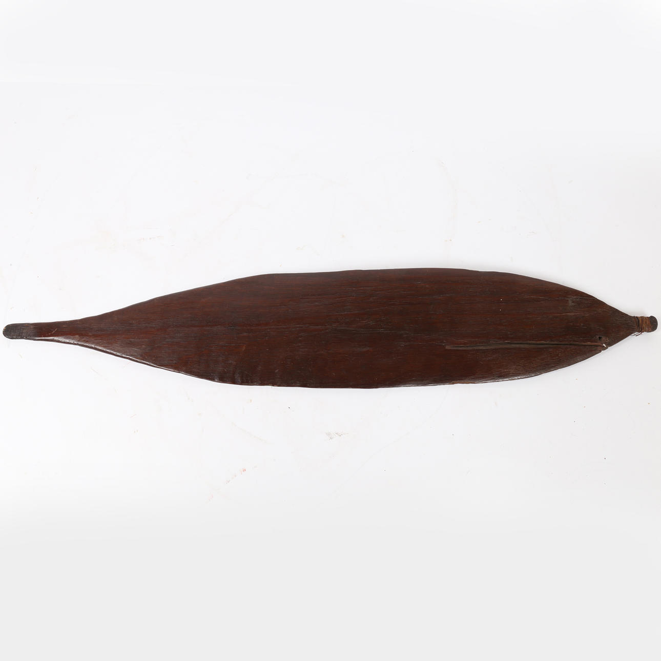 AN ABORIGINAL AUSTRALIAN WOOMERA SPEAR THROWER.