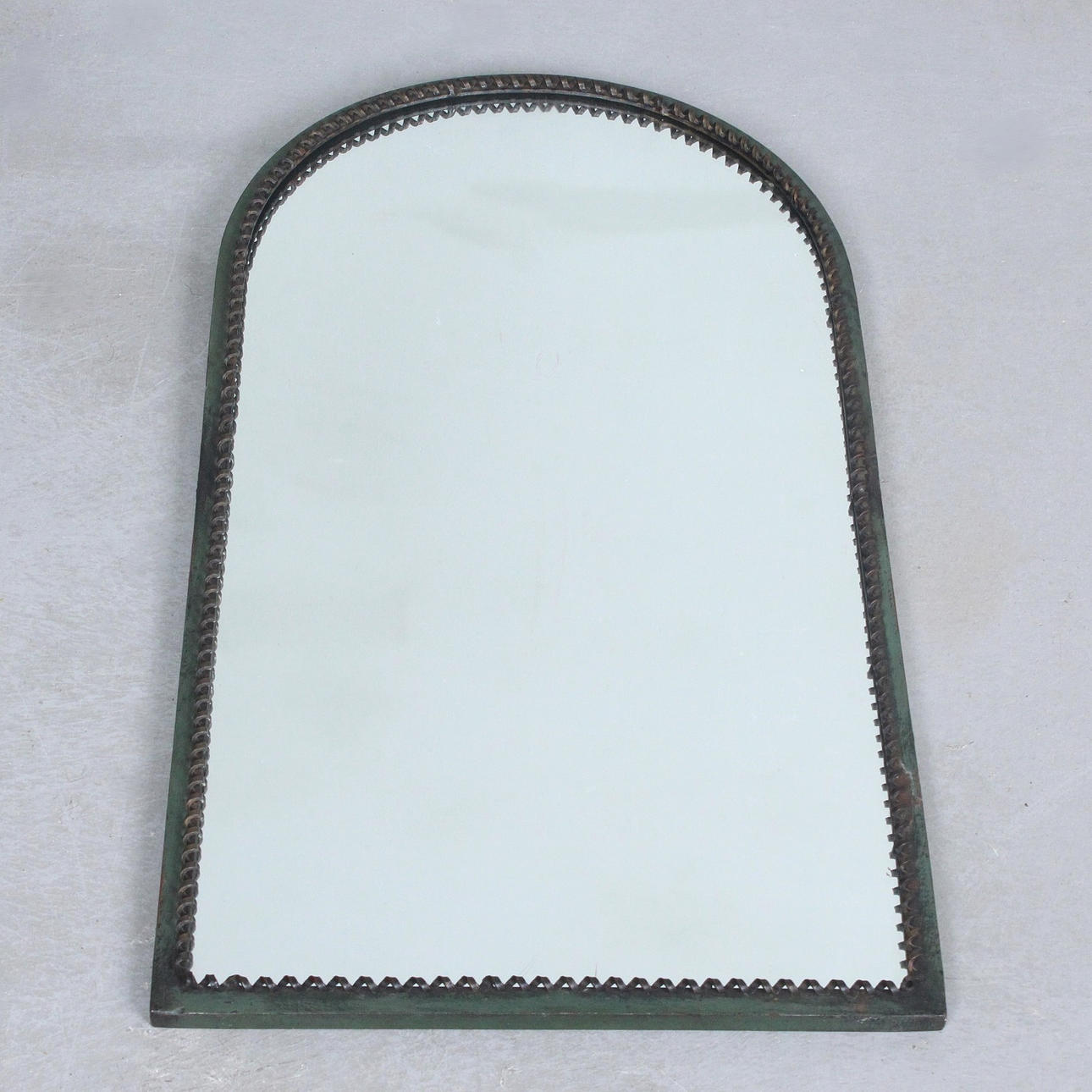 wall mirror with decorated edge.