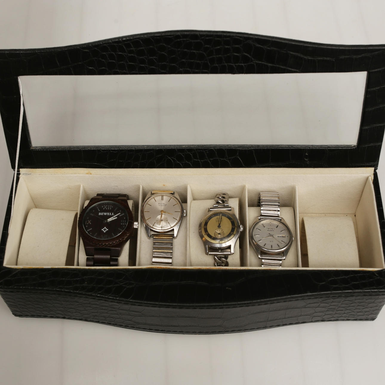 PARTI WRISTWATCH and storage box.