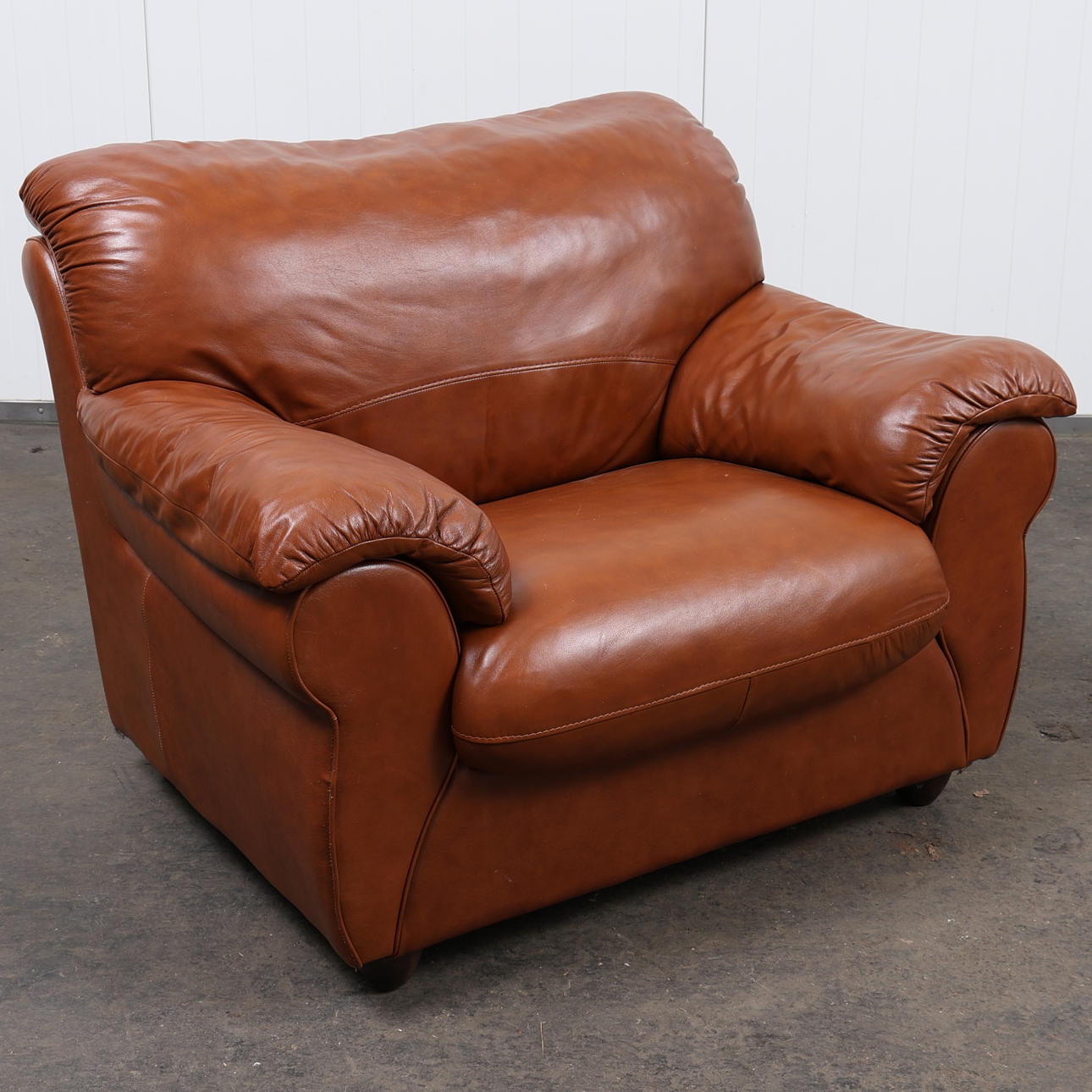 A brown leather armchair, Contempo, 2000s.