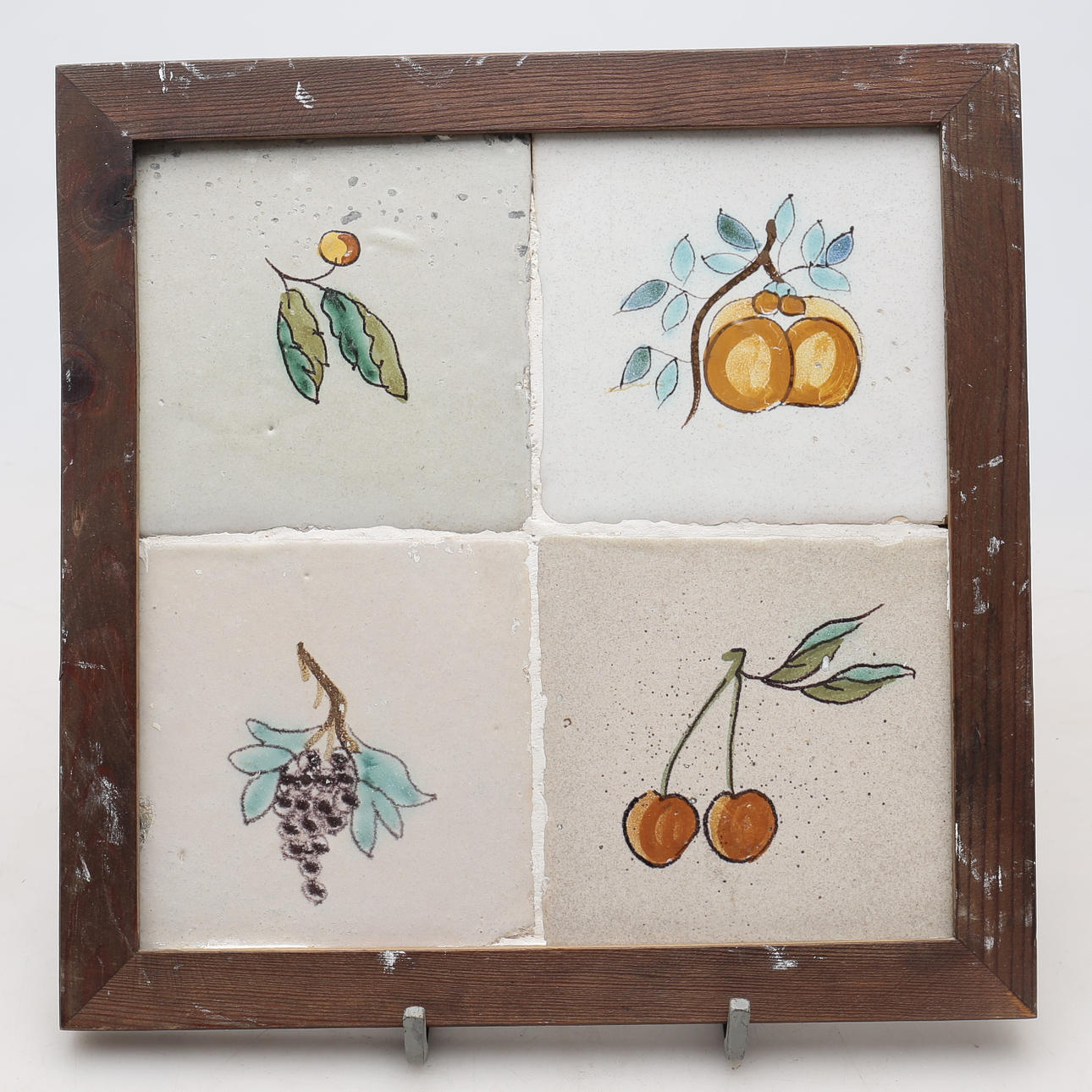 Panel with four Catalan “fruit” tiles, late 18th Century.