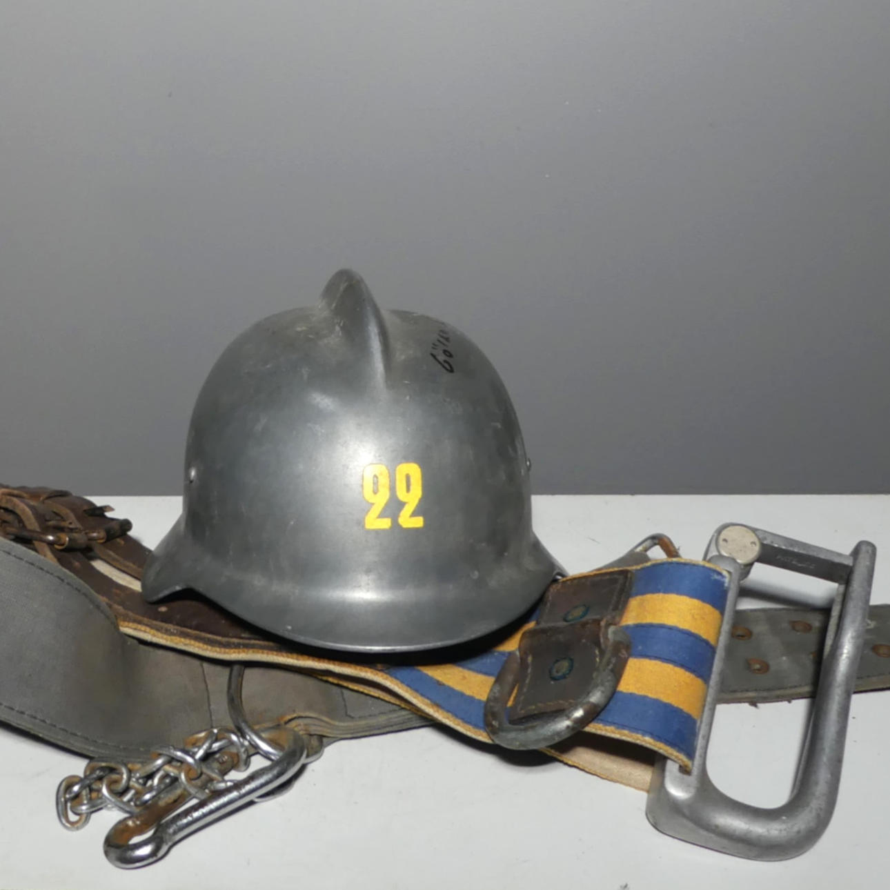 FIRE STATION EQUIPMENT, helmet with 2 belts.
