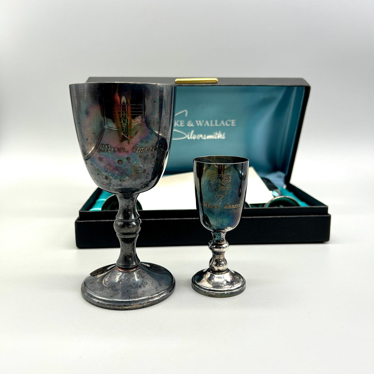 BURKE AND WALLACE SET: 2 LARGE AND 4 SMALL SILVER-PLATED GOBLETS.
