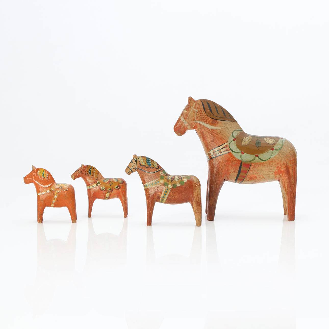 DALAHORSES, FOUR PCS. Painted wood.