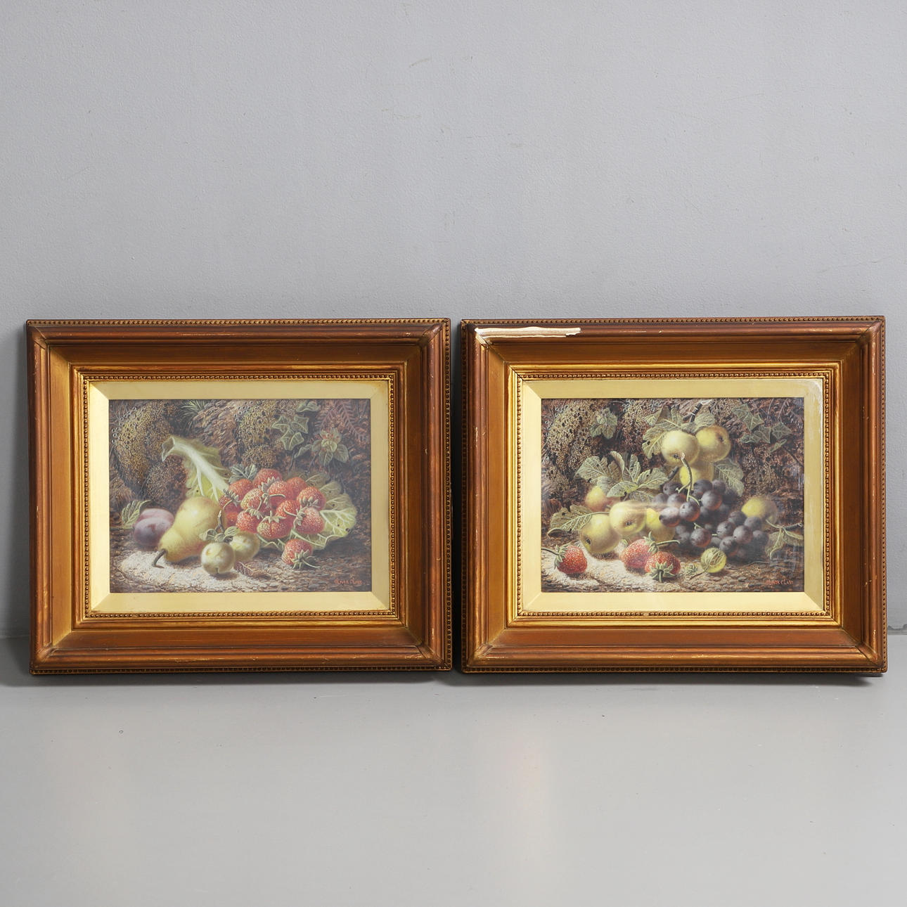OLIVER CLARE (1852-1927). APPLES, GRAPES, STRAWBERRIES AND GOOSEBERRIES; A PEAR, PLUMS, GREENGAGES AND STRAWBERRIES UPON A CABBAGE LEAF.