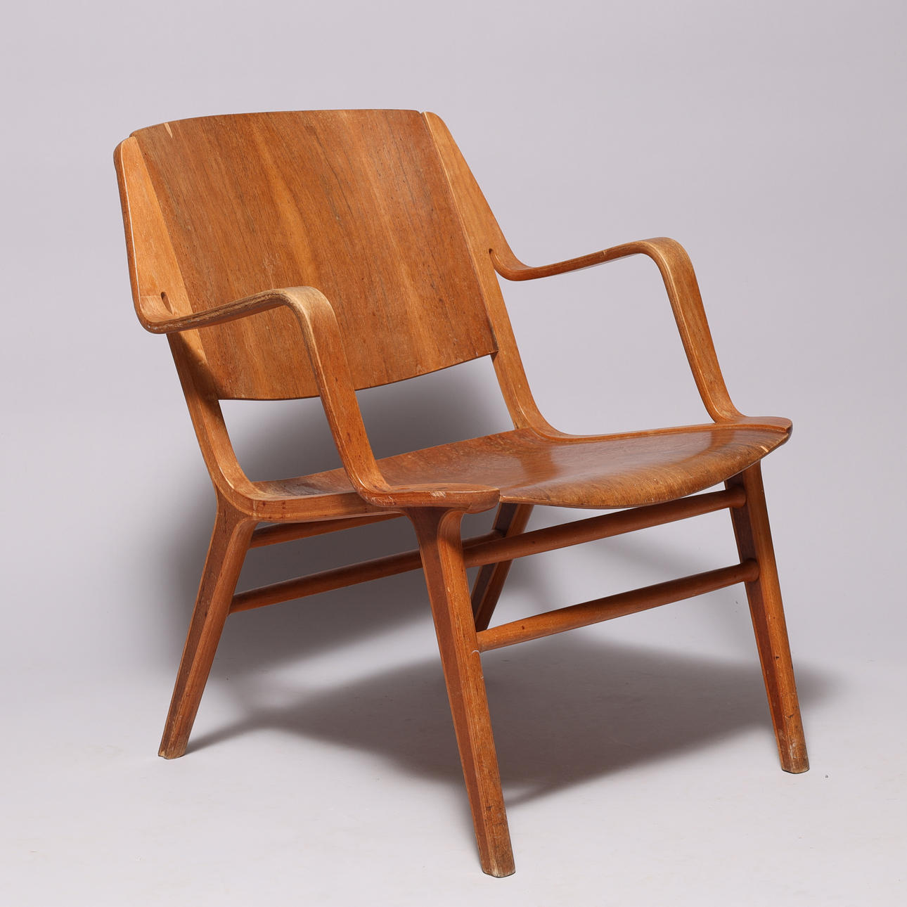 PETER HVIDT & ORLA MØLGAARD-NIELSEN. “AX” beech and teak armchair, Fritz Hansen, model 6000, Denmark, designed 1947.