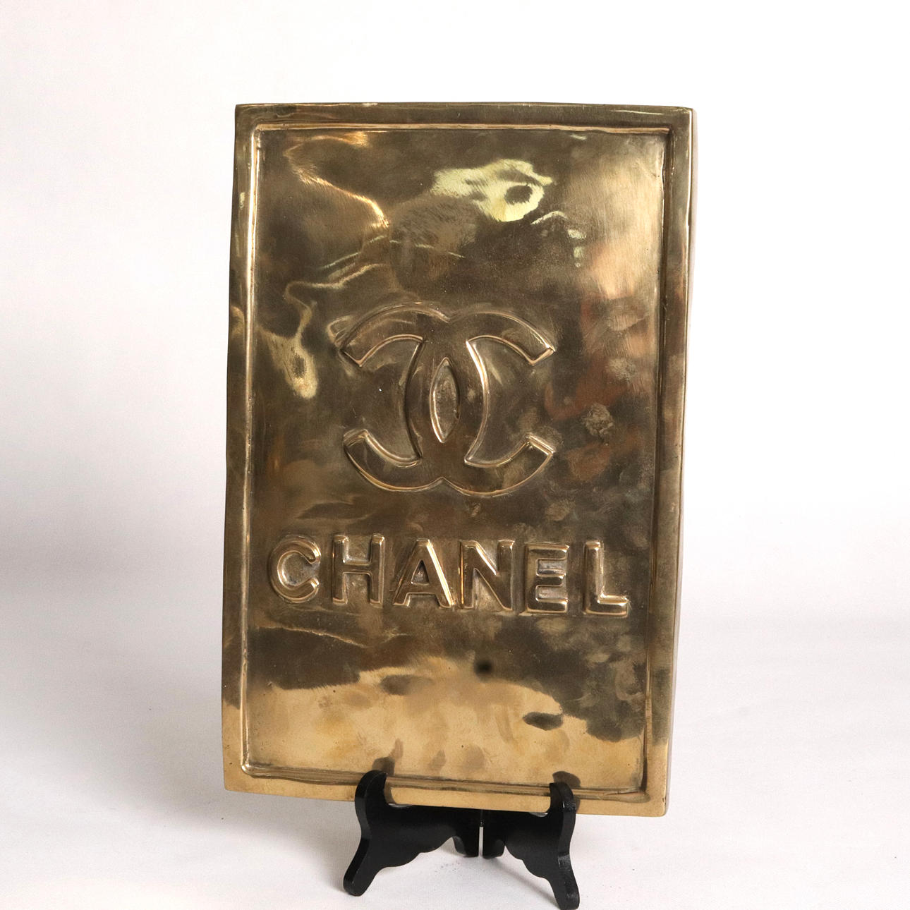 SIGN, gold patinated bronze, “Coco Chanel”.