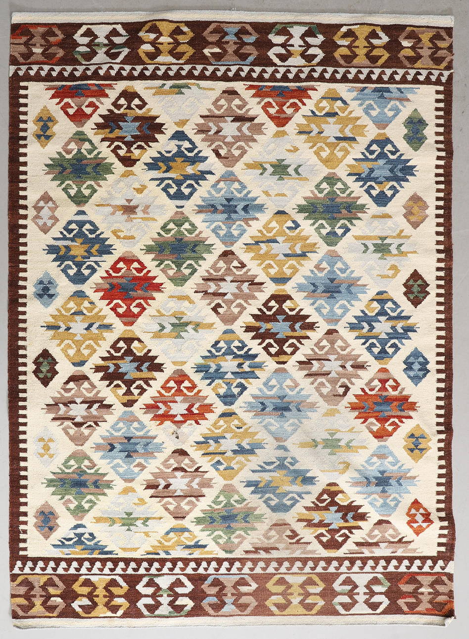 A CARPET, woven, 229 x 164 cm.